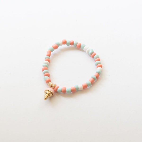 an elastic beaded bracelet with ice cream charm