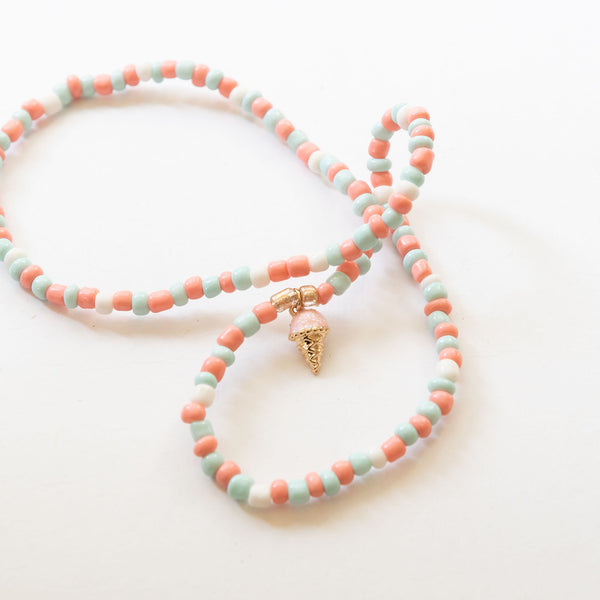 a beaded necklace with ice cream charm