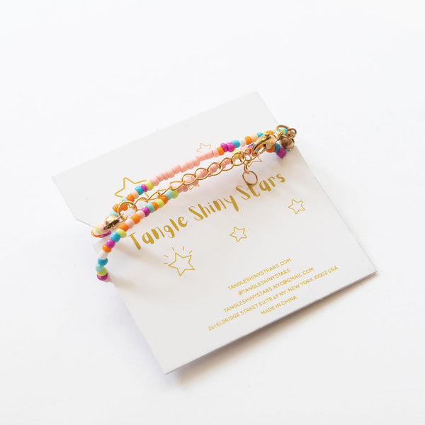 beaded necklace with tassels on the back of the tag