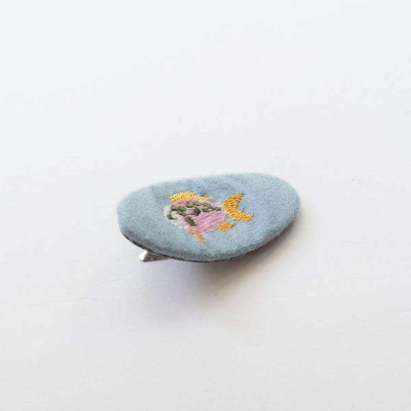 oval blue hair snap clip with fish embroidered