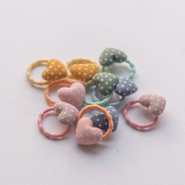 bunch of mini heart polka dot hair ties : blue, green, peach, pink, yellow