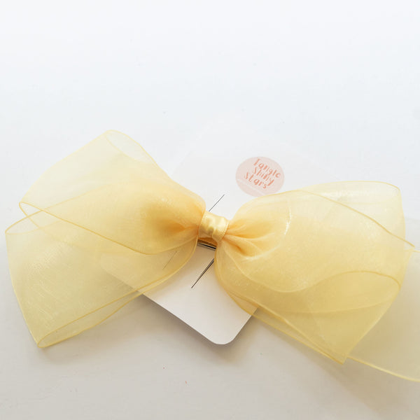 yellow chiffon large bow hair clip on the tag