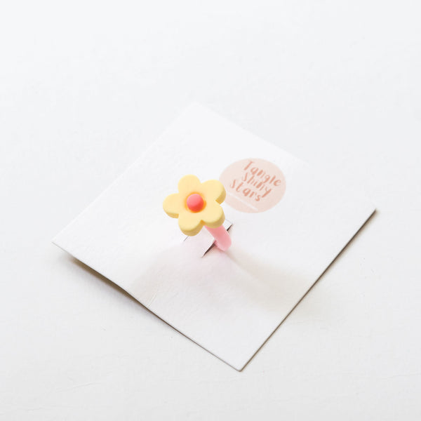 yellow flower plastic band ring on the tag