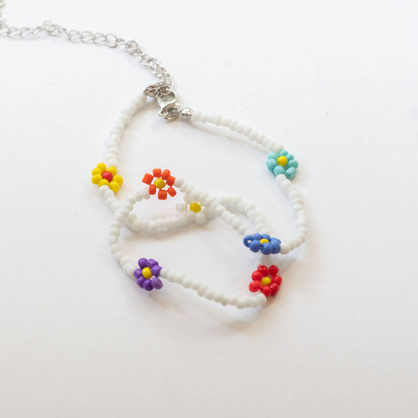 white beaded necklace with colorful flowers