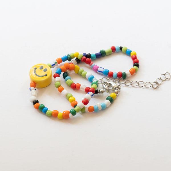 multi colored beaded necklace with smiley charm