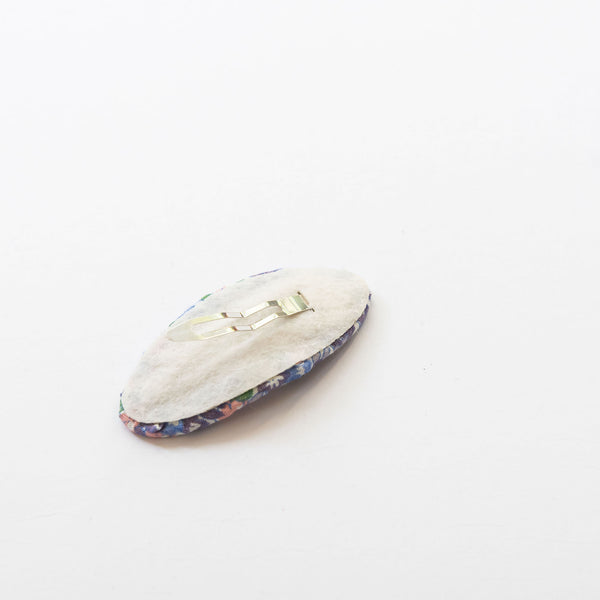 back side of oval embroidered hair snap clip