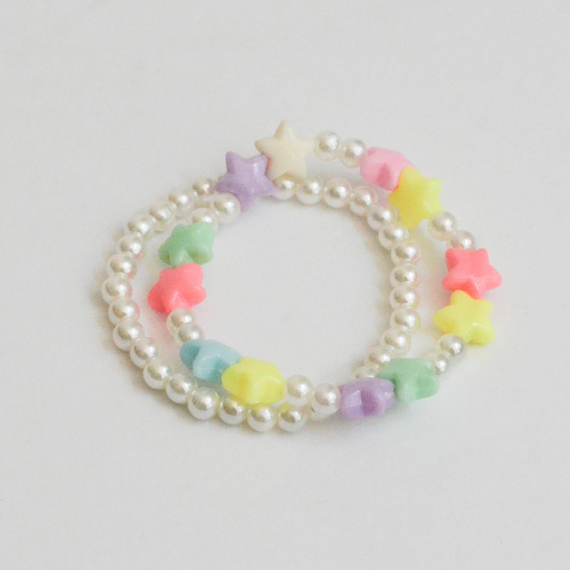 pearl bracelet with colorful star charms