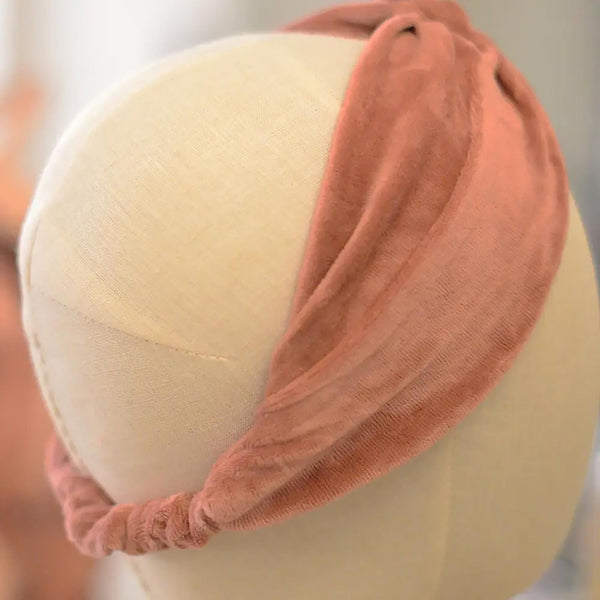 mannequin with twisted velvet headband on the side view